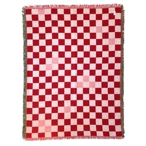 Pink and red checker woven blanket